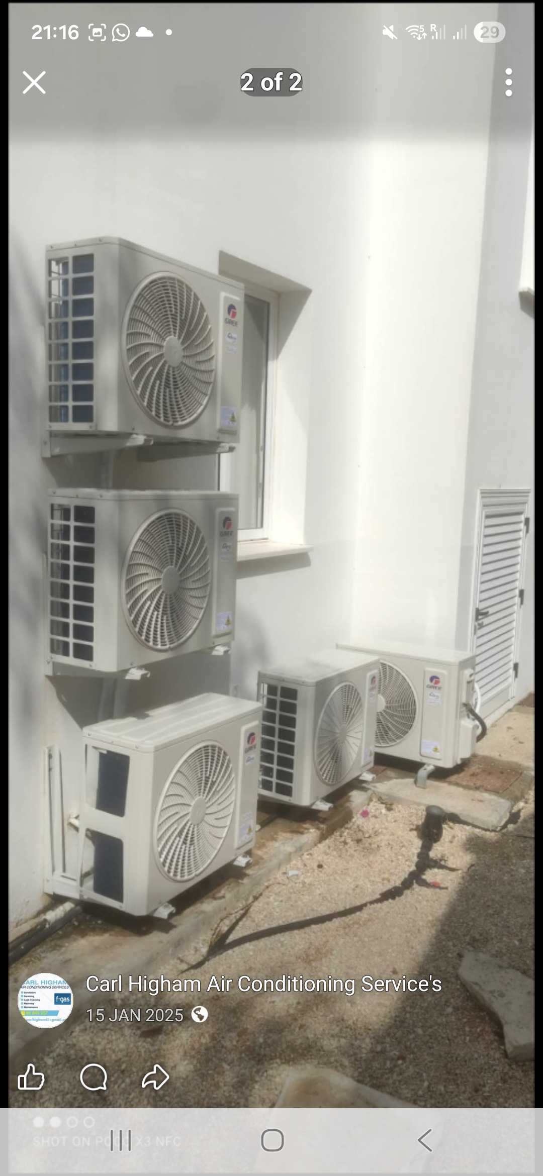 Multi-unit Gree condenser installation on a villa exterior wall